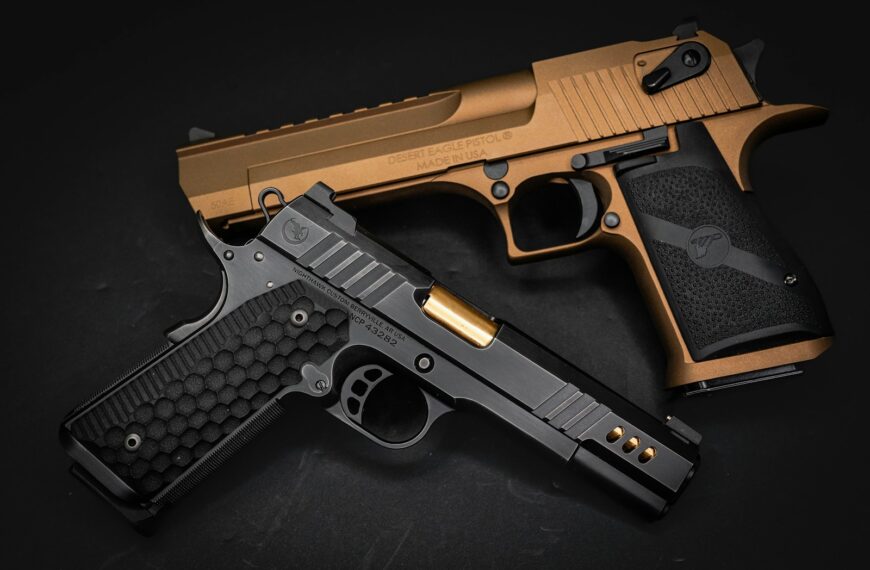 a gold and black gun on a black background