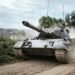 battle tank on green grass field during daytime